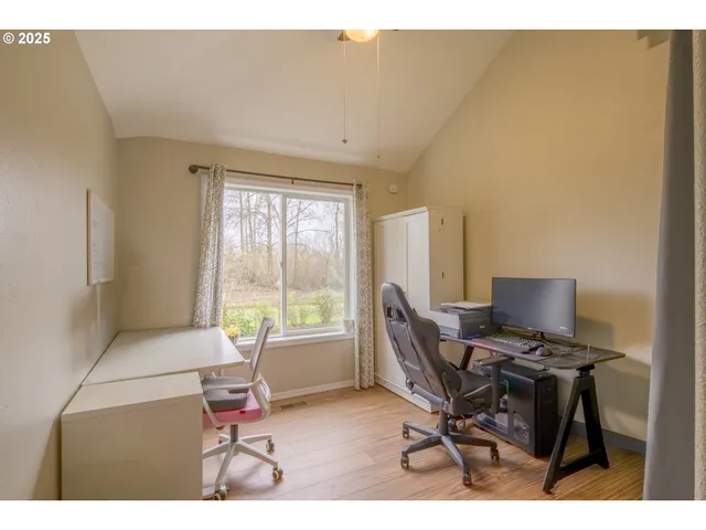 a workspace with furniture and a window
