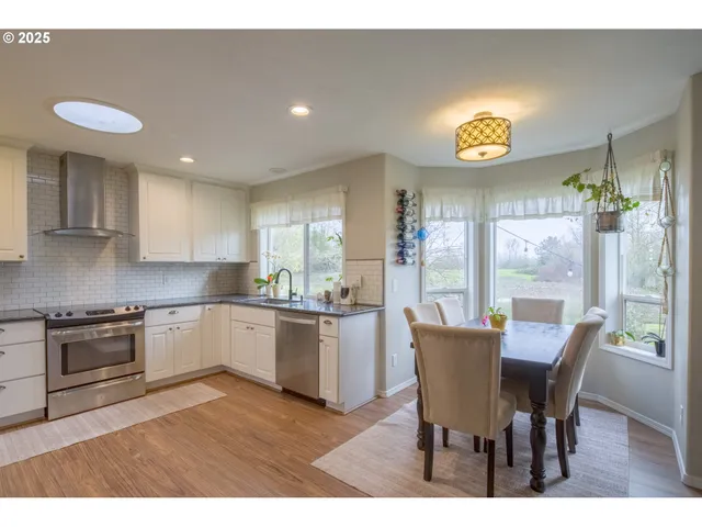a kitchen with a table and chairs in it