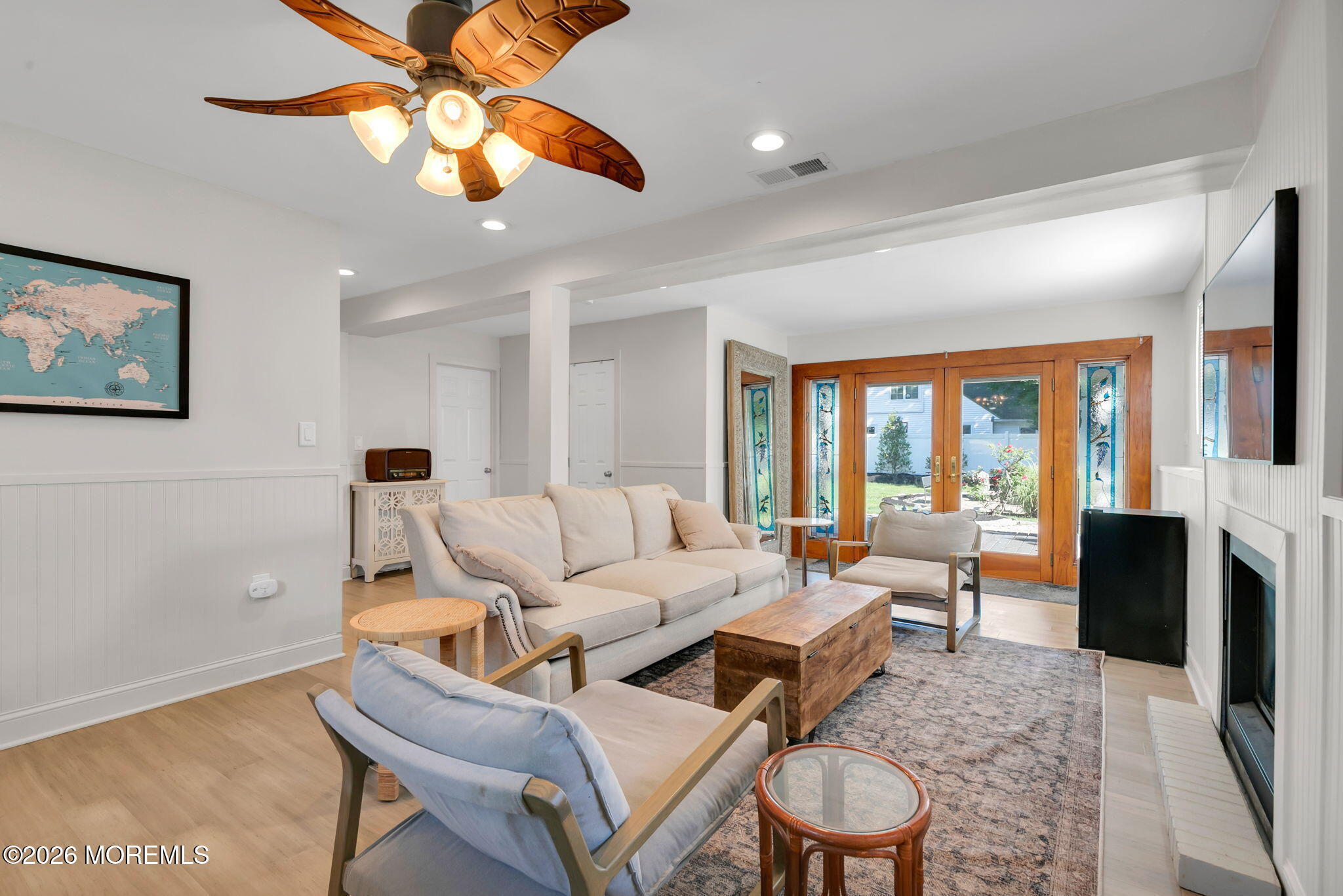 53 Field Avenue Red Bank, NJ 07701 - Photo 18 of 39 a living room with furniture a fireplace and a large window