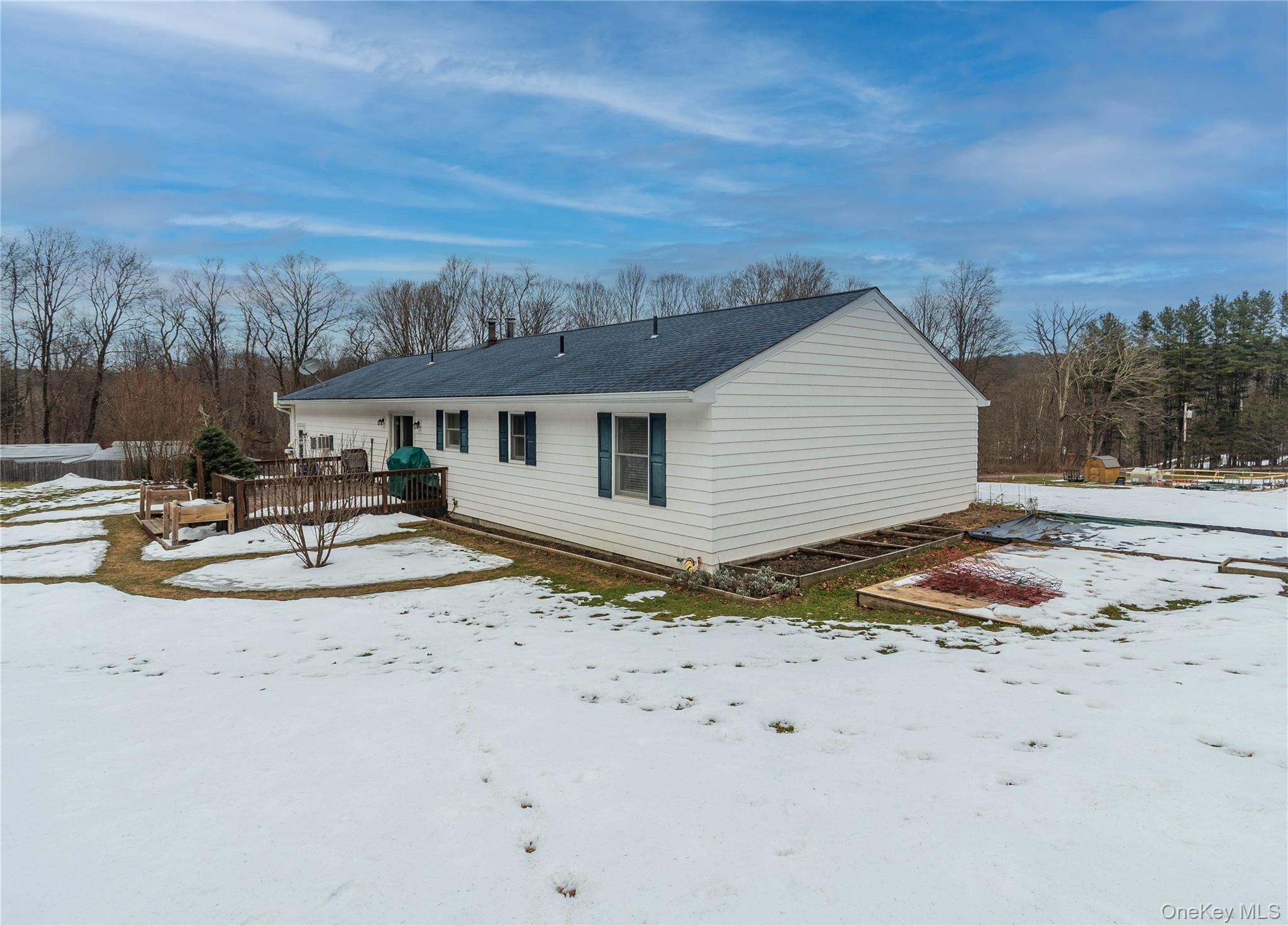 503 Chestnut Ridge Road Dover Plains, NY 12522 - Photo 33 of 41 a backyard of a house with table and chairs