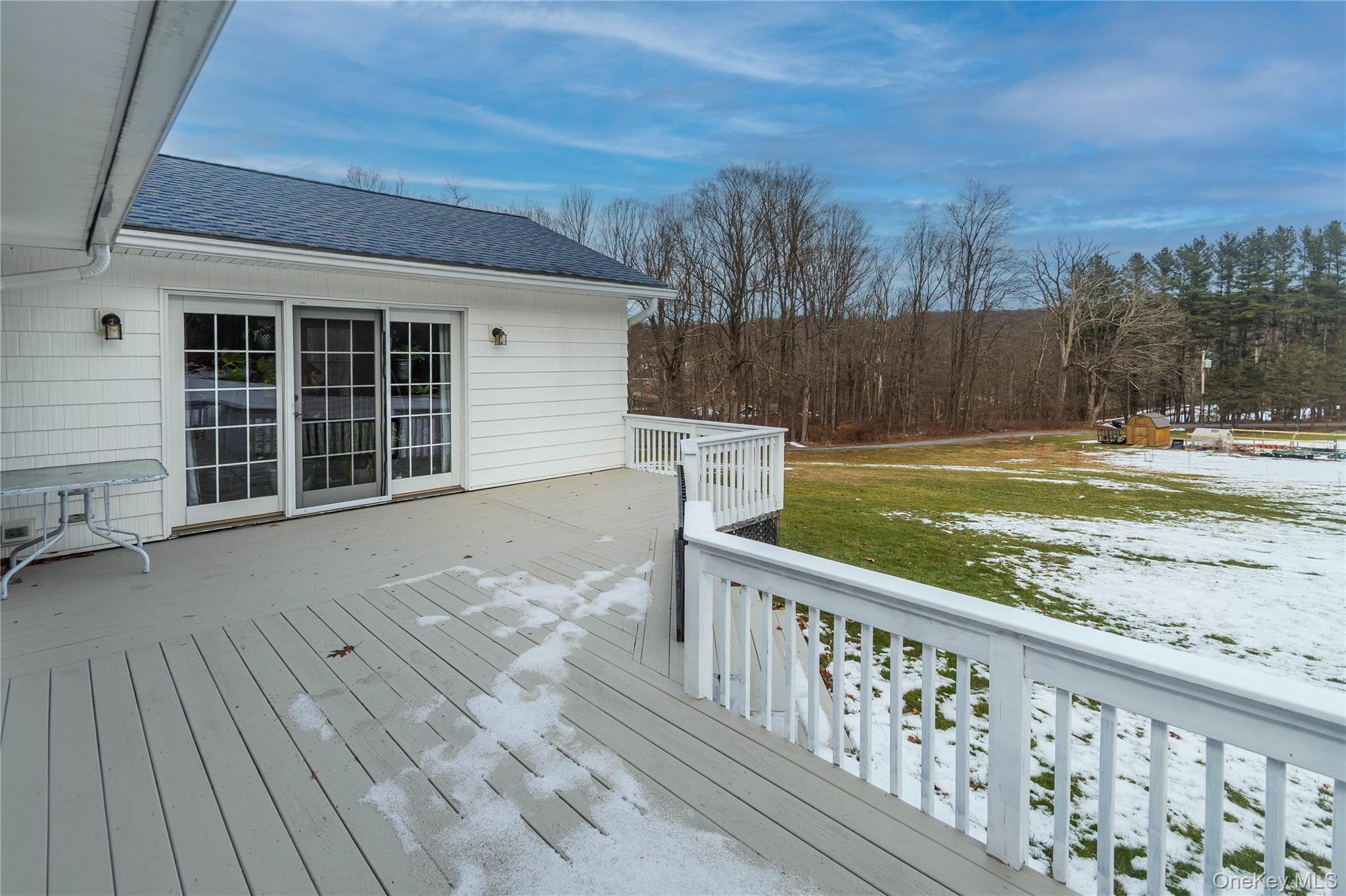 503 Chestnut Ridge Road Dover Plains, NY 12522 - Photo 6 of 41 a view of a balcony with wooden floor and fence