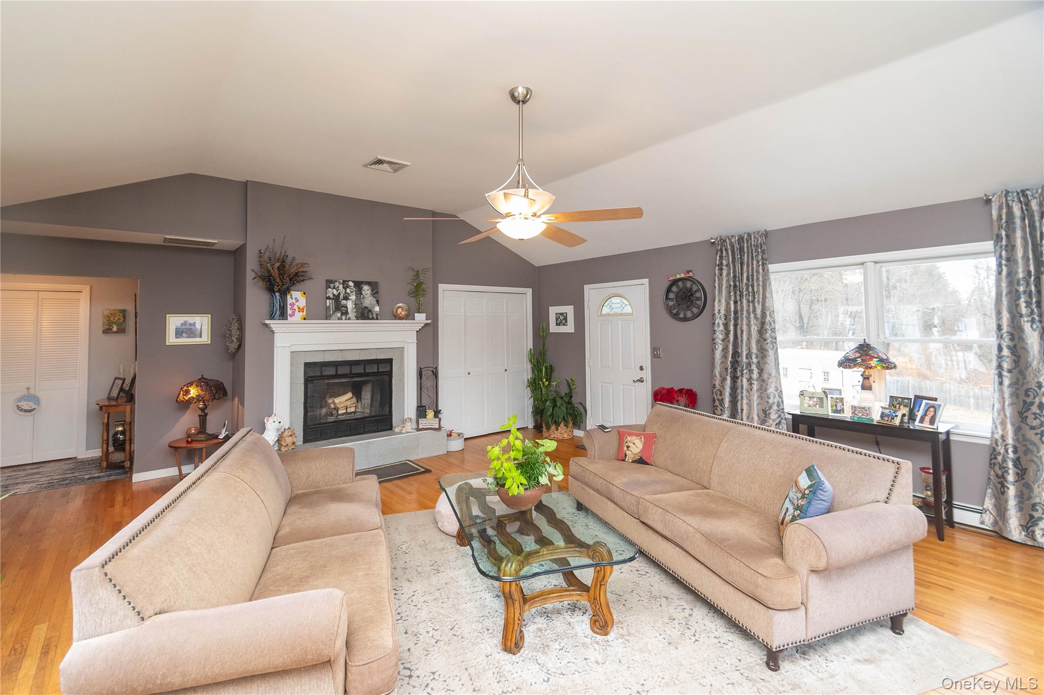 503 Chestnut Ridge Road Dover Plains, NY 12522 - Photo 9 of 41 a living room with furniture and a fireplace