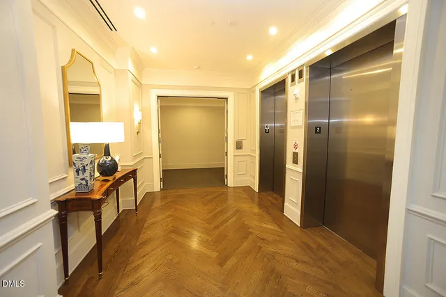 a view of a livingroom with furniture and a window
