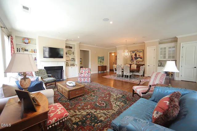 a living room with furniture fireplace and a flat screen tv
