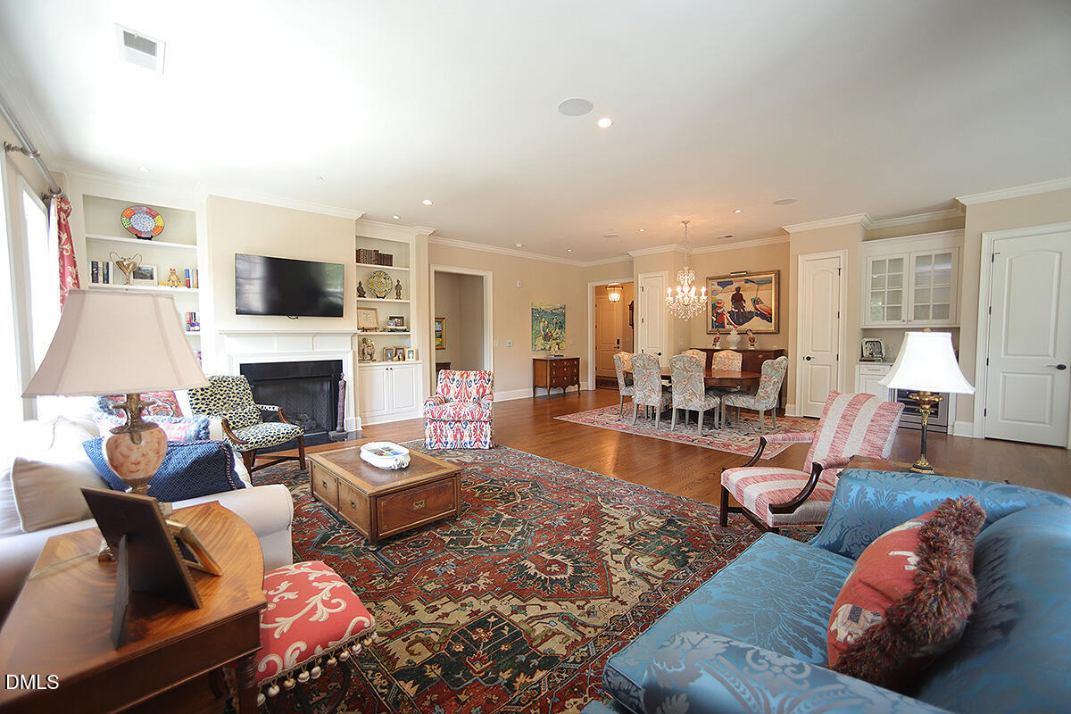 620 Wade Avenue, Unit 206 Raleigh, NC 27605 - Photo 20 of 42 a living room with furniture fireplace and a flat screen tv