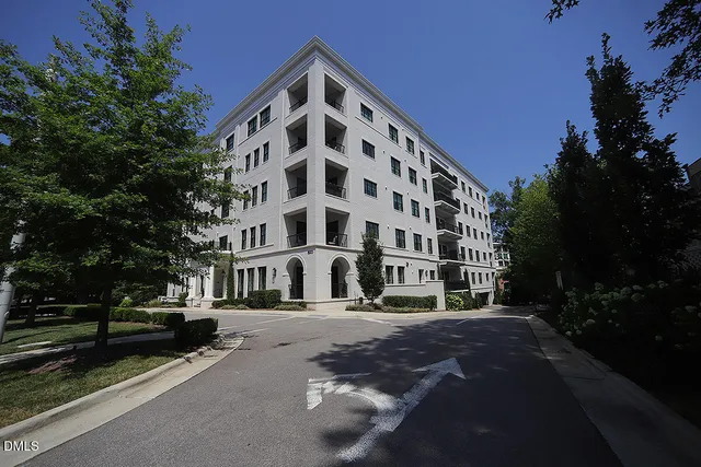 a view of a building with a street