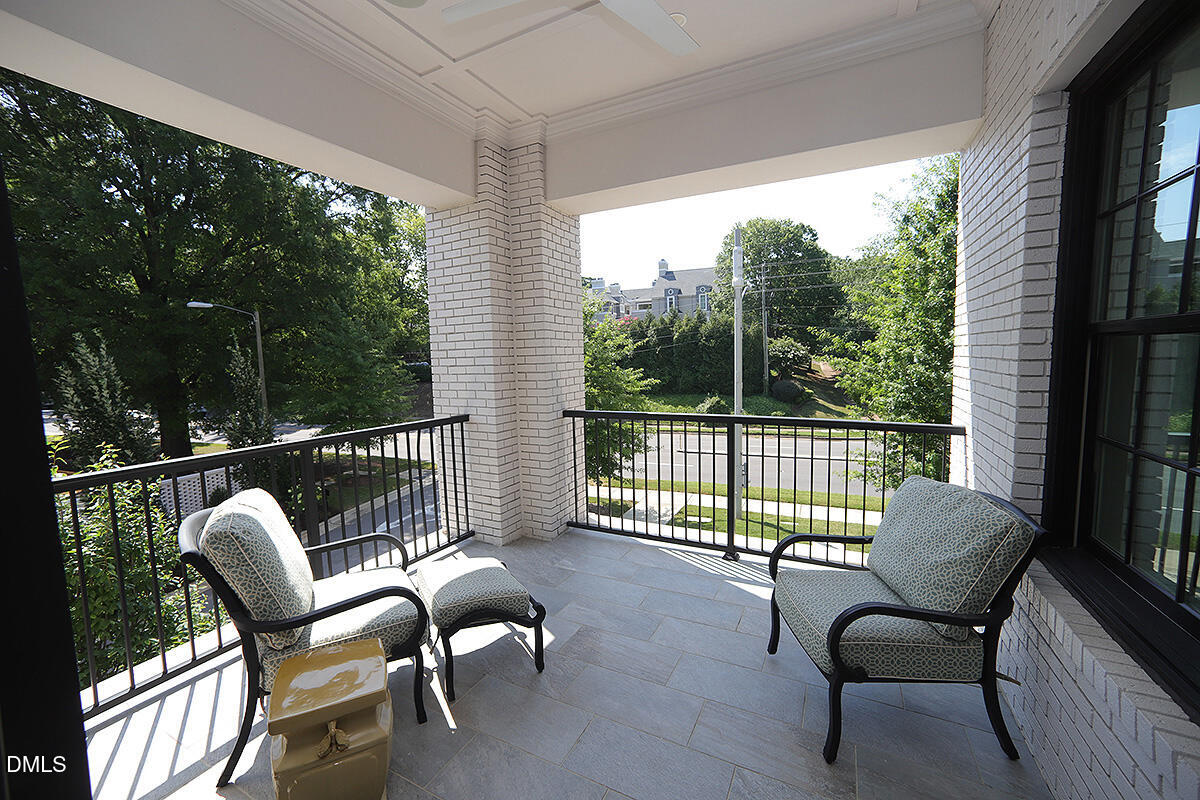620 Wade Avenue, Unit 206 Raleigh, NC 27605 - Photo 29 of 42 a view of a chair and table in the balcony