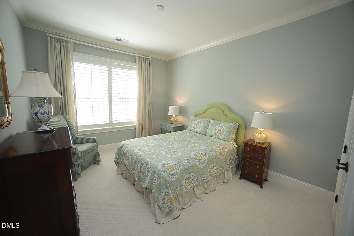 620 Wade Avenue, Unit 206 Raleigh, NC 27605 - Photo 38 of 42 a bedroom with a bed and window