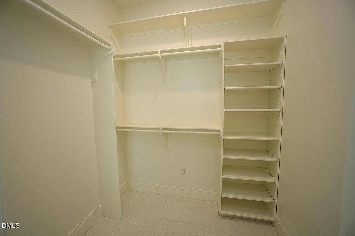 620 Wade Avenue, Unit 206 Raleigh, NC 27605 - Photo 39 of 42 a view of walk in closet with empty racks