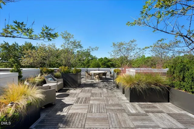 a view of a balcony with chairs