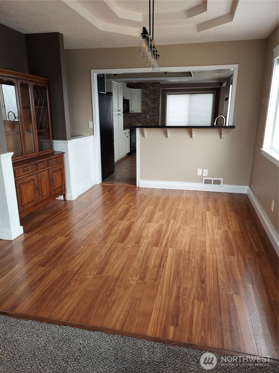 405 Strand Road Ephrata, WA 98823 - Photo 11 of 26 a view of a kitchen with wooden floor and a refrigerator