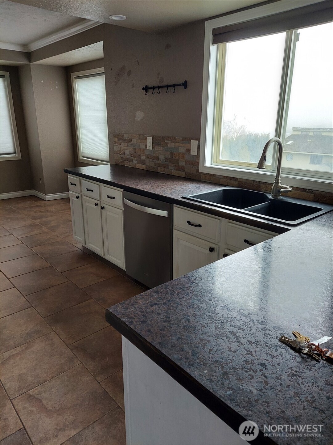 405 Strand Road Ephrata, WA 98823 - Photo 13 of 26 a kitchen with granite countertop a sink and a window