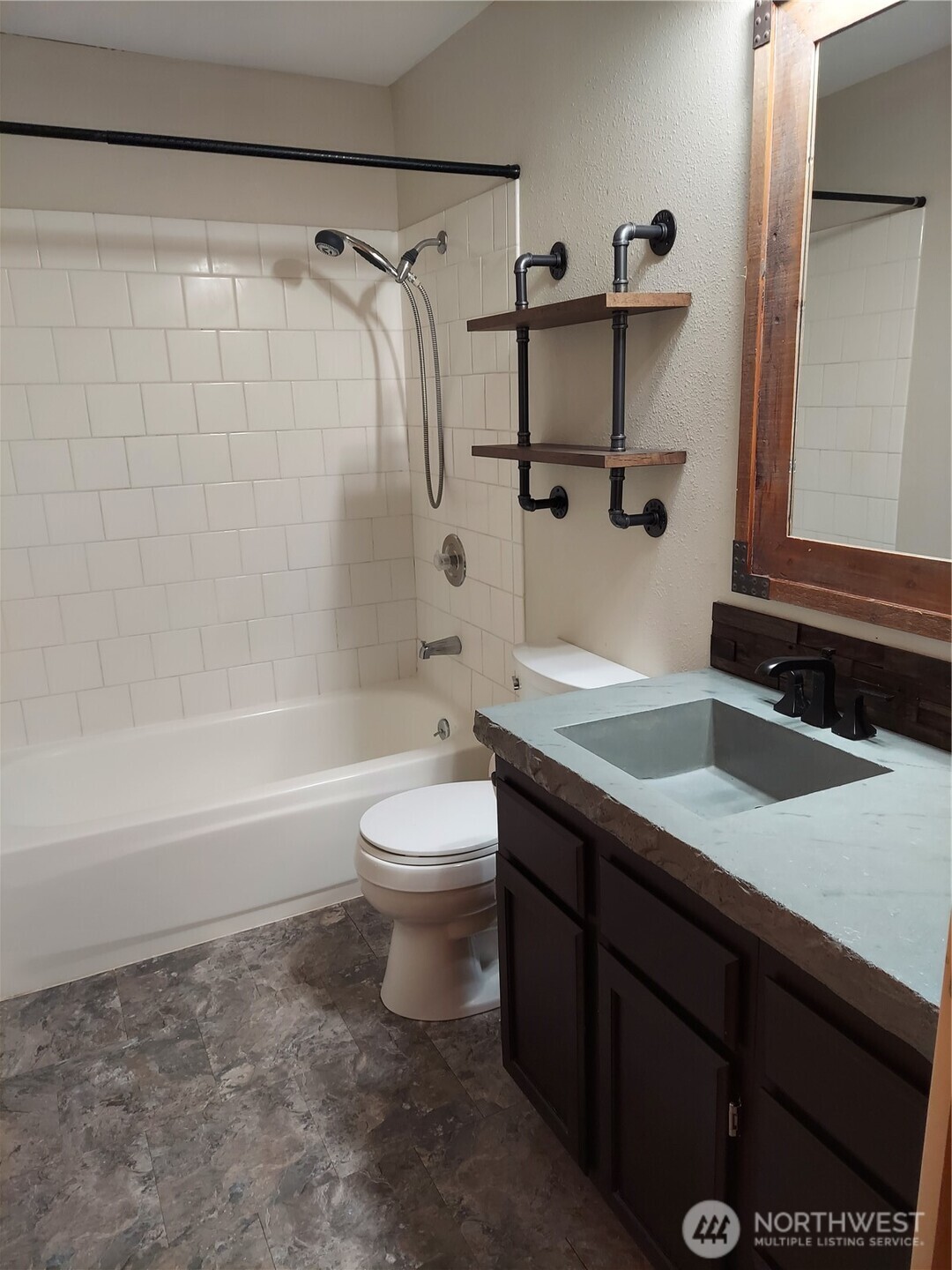 405 Strand Road Ephrata, WA 98823 - Photo 10 of 26 a bathroom with a granite countertop sink toilet and shower