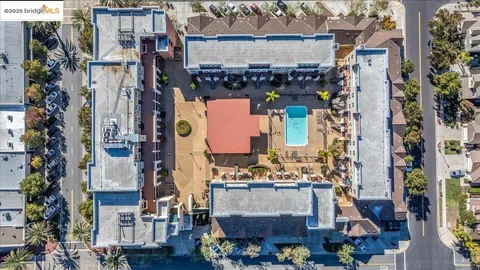 a view of a swimming pool with a lounge chairs