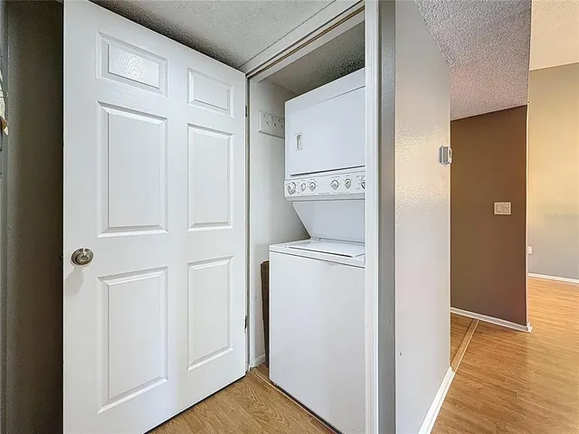 a view of a patio with a table and chairs