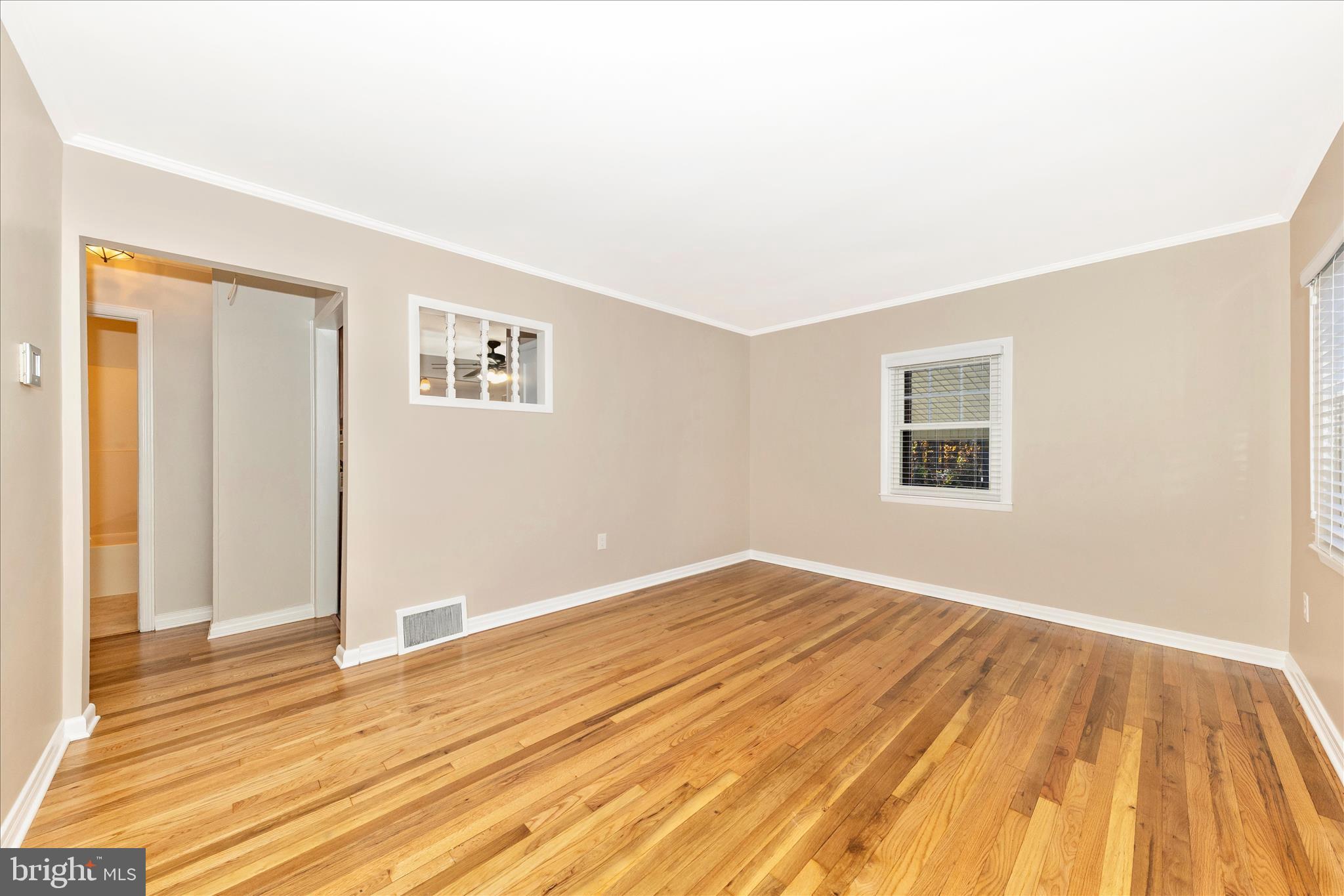 4410 Fernhill Road Silver Spring, MD 20906 - Photo 3 of 49 a view of an empty room with wooden floor
