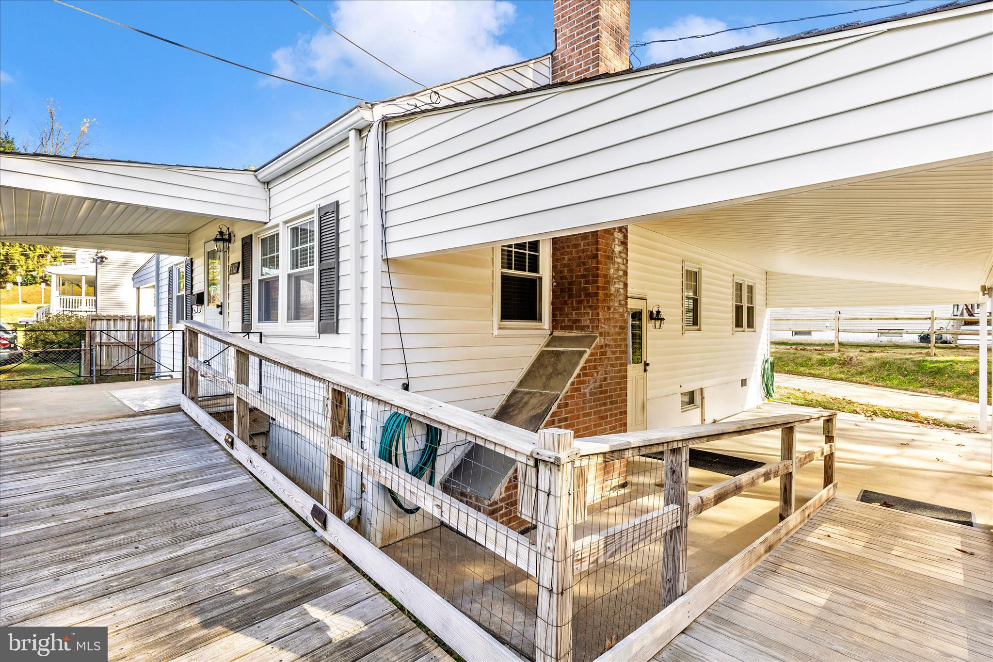 4410 Fernhill Road Silver Spring, MD 20906 - Photo 39 of 49 a view of a balcony with wooden floor and iron stairs