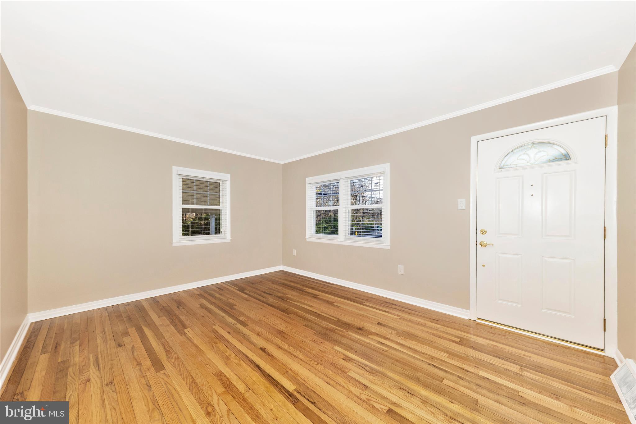 4410 Fernhill Road Silver Spring, MD 20906 - Photo 4 of 49 an empty room with wooden floor and windows