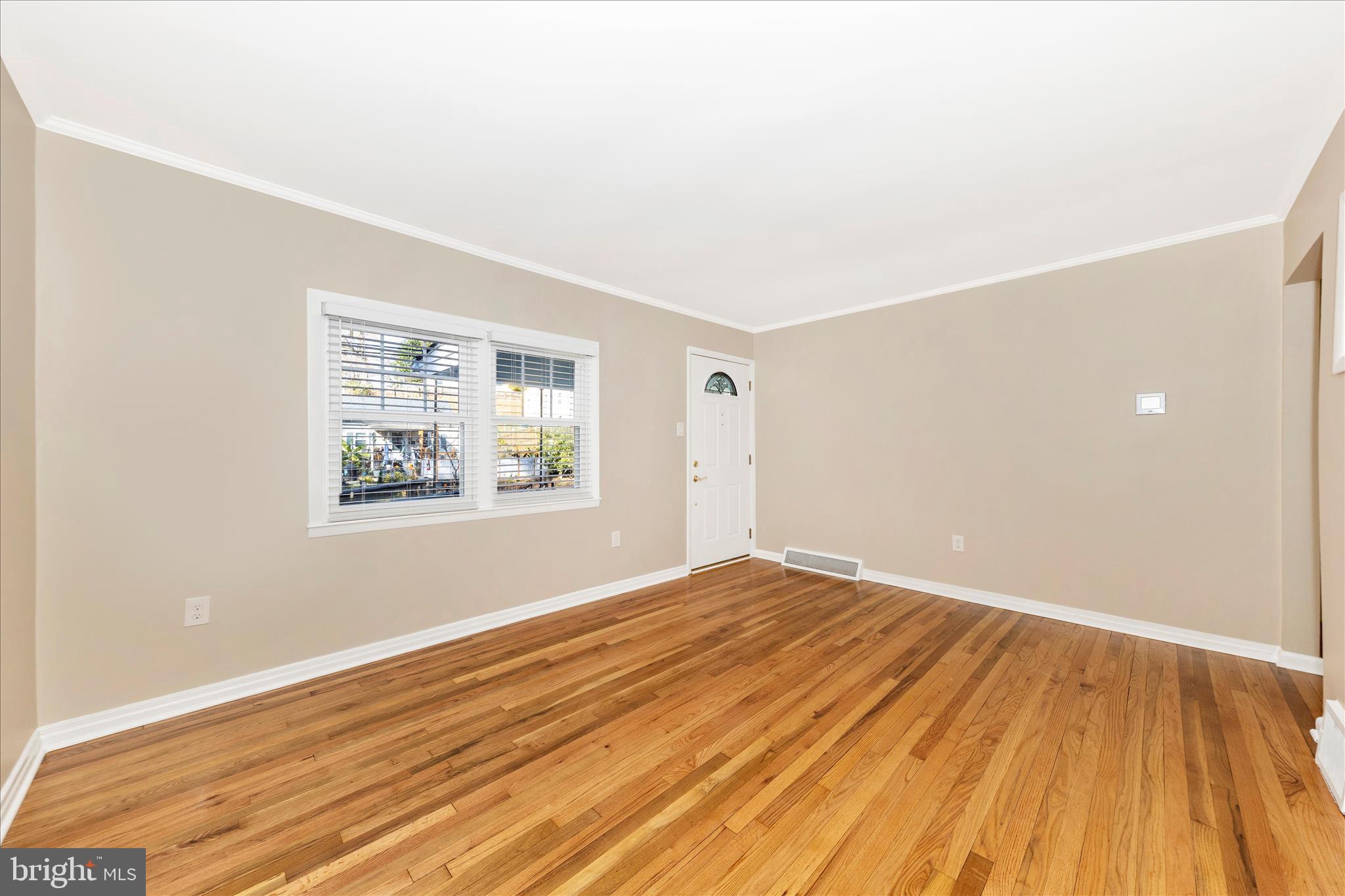 4410 Fernhill Road Silver Spring, MD 20906 - Photo 5 of 49 an empty room with wooden floor and windows