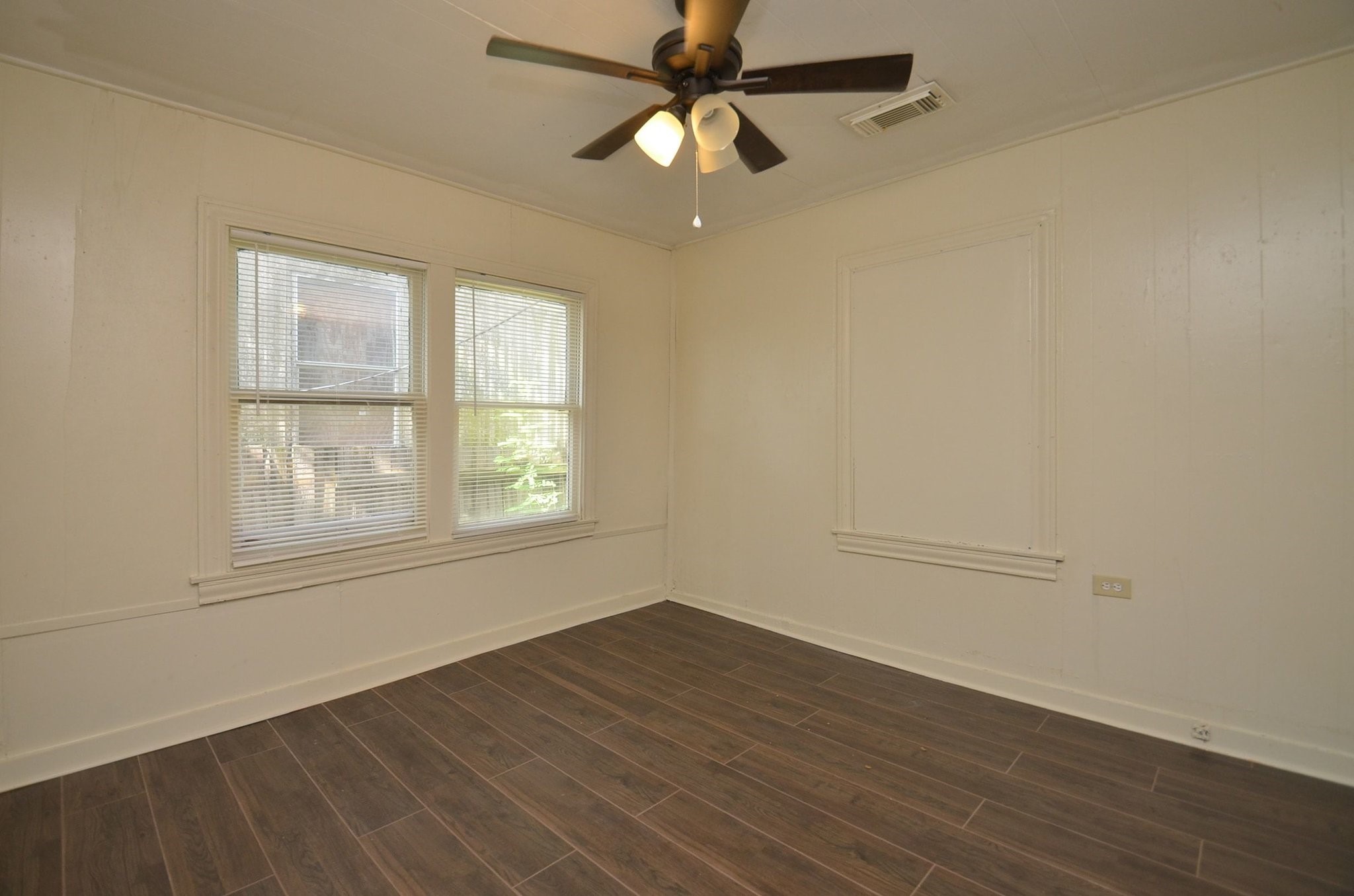 1600 5th Street Rosenberg, TX 77471 - Photo 16 of 24 Spacious primary bedroom with multiple windows.