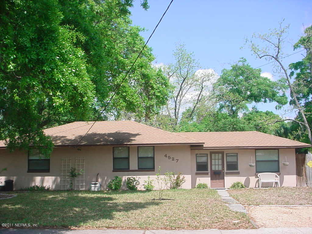 4527 Manchester Road Jacksonville, FL 32210 - Photo 4 of 20 a front view of a house with garden