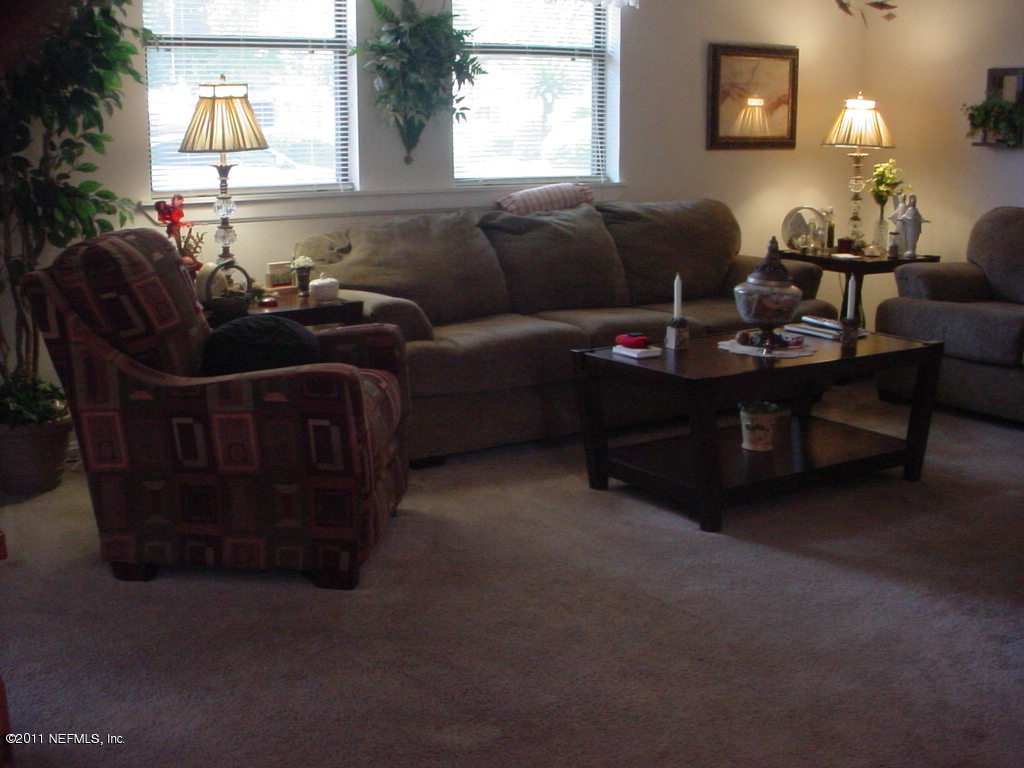 4527 Manchester Road Jacksonville, FL 32210 - Photo 8 of 20 a living room with furniture and a window