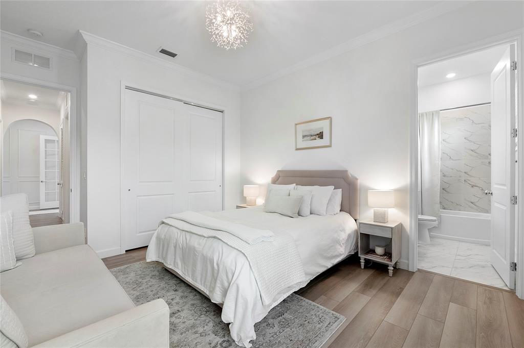 1131 Chisel Plow Chase Loxahatchee, FL 33470 - Photo 14 of 72 a bedroom with a bed and a chandelier