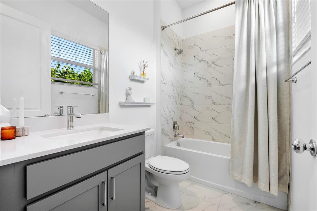 1131 Chisel Plow Chase Loxahatchee, FL 33470 - Photo 16 of 72 a bathroom with a granite countertop sink toilet and shower