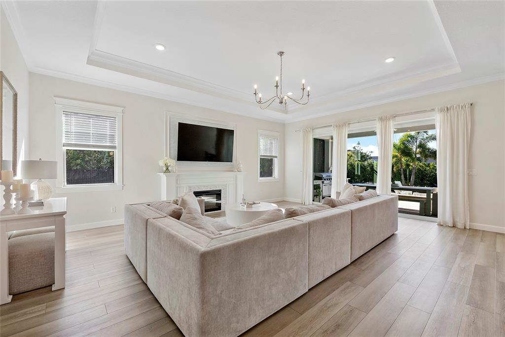 1131 Chisel Plow Chase Loxahatchee, FL 33470 - Photo 19 of 72 a view of living room with kitchen island furniture and flat screen tv