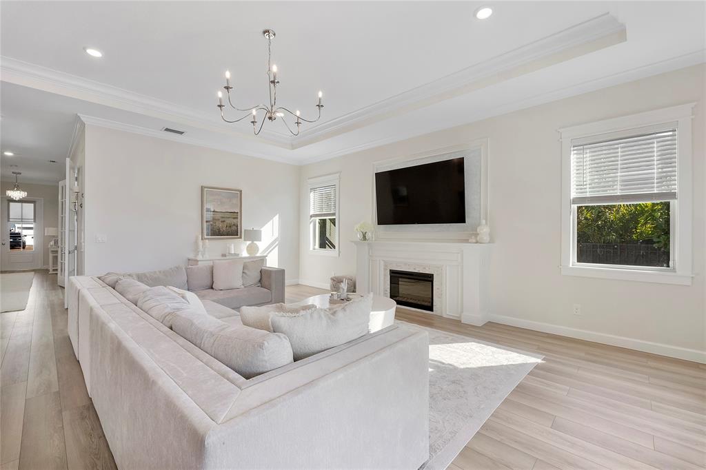 1131 Chisel Plow Chase Loxahatchee, FL 33470 - Photo 21 of 72 a living room with furniture a fireplace and a flat screen tv