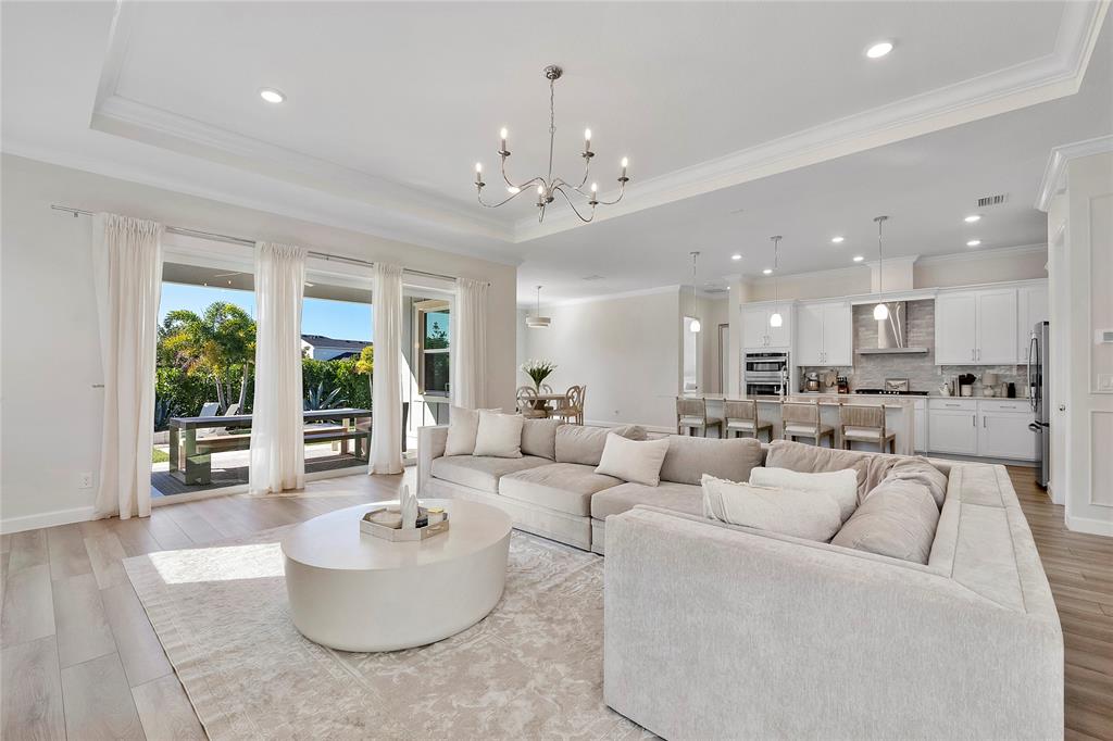 1131 Chisel Plow Chase Loxahatchee, FL 33470 - Photo 23 of 72 a living room with furniture and a large window