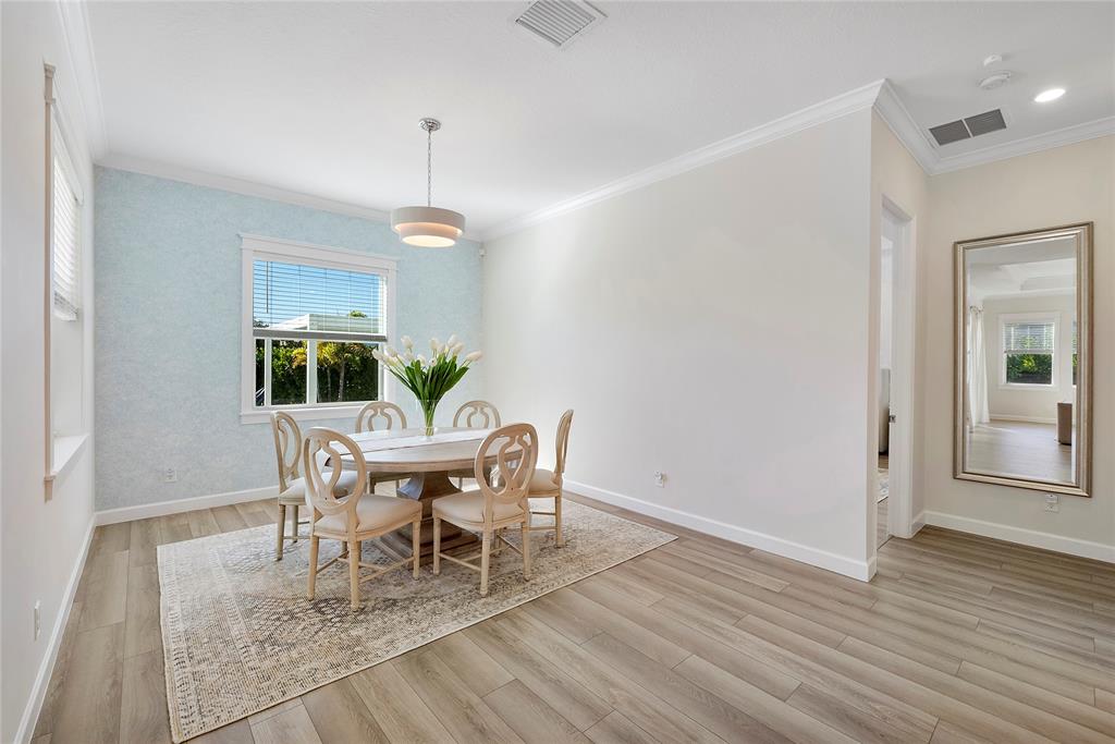 1131 Chisel Plow Chase Loxahatchee, FL 33470 - Photo 29 of 72 a dining room with furniture window and wooden floor