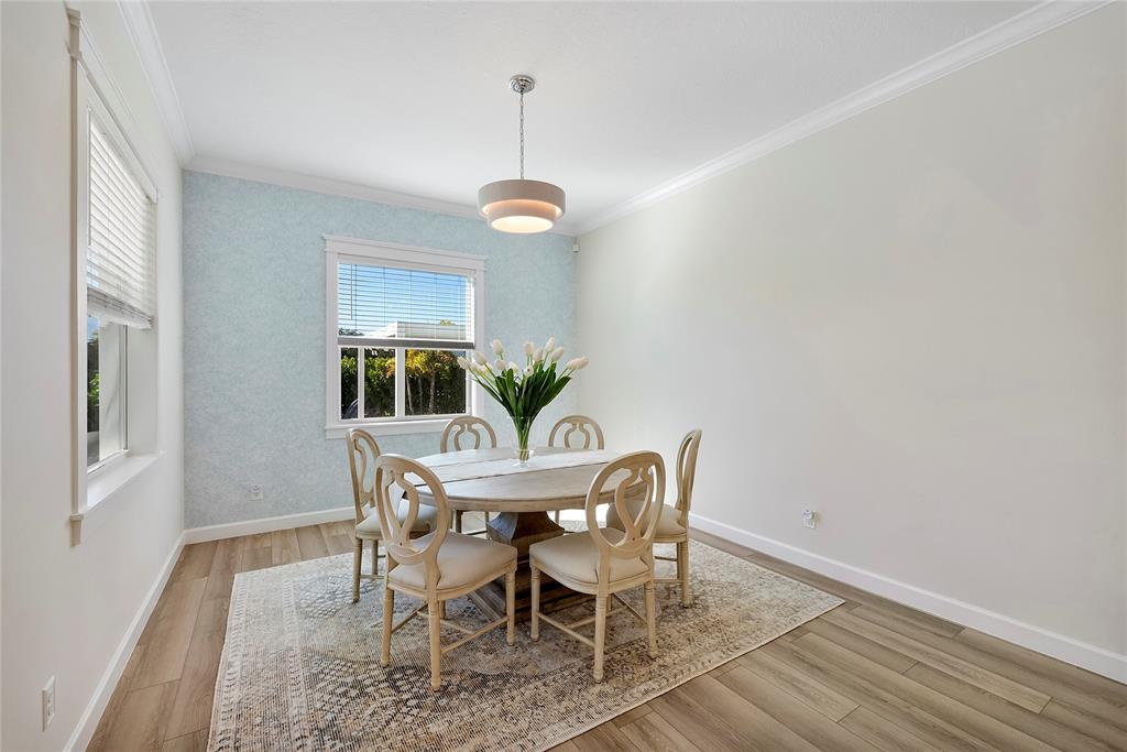 1131 Chisel Plow Chase Loxahatchee, FL 33470 - Photo 30 of 72 a view of a dining room with a table and chairs