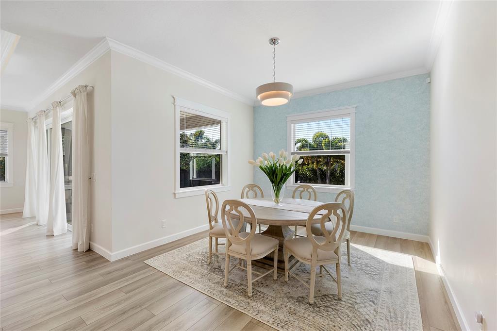 1131 Chisel Plow Chase Loxahatchee, FL 33470 - Photo 32 of 72 a view of a dining room with furniture window and wooden floor