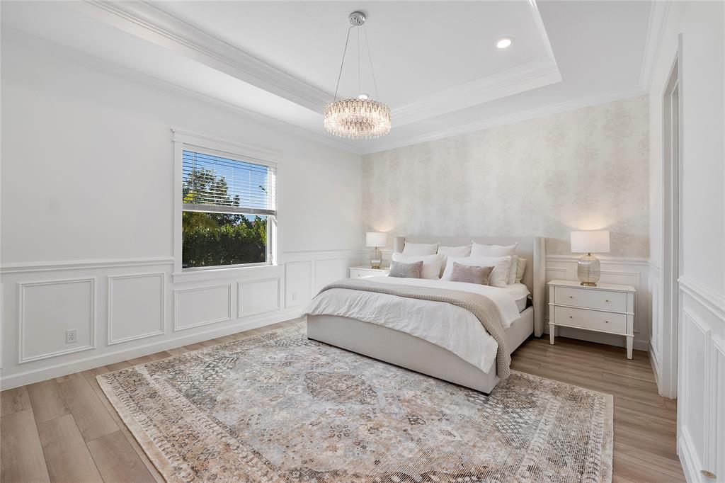 1131 Chisel Plow Chase Loxahatchee, FL 33470 - Photo 34 of 72 a spacious bedroom with a bed and a window