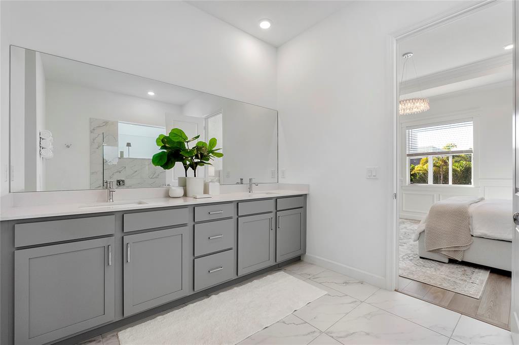 1131 Chisel Plow Chase Loxahatchee, FL 33470 - Photo 38 of 72 a bathroom with a sink and a mirror