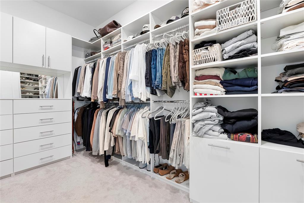 1131 Chisel Plow Chase Loxahatchee, FL 33470 - Photo 40 of 72 a view of walk in closet with clothes and shoes