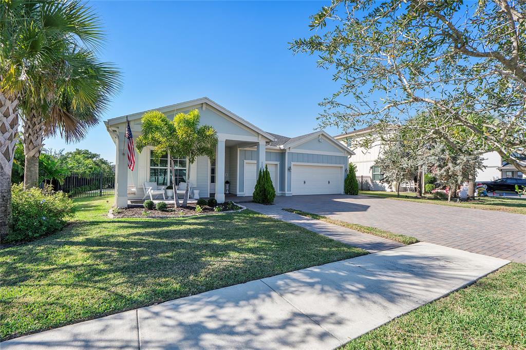 1131 Chisel Plow Chase Loxahatchee, FL 33470 - Photo 4 of 72 a front view of house with yard and green space