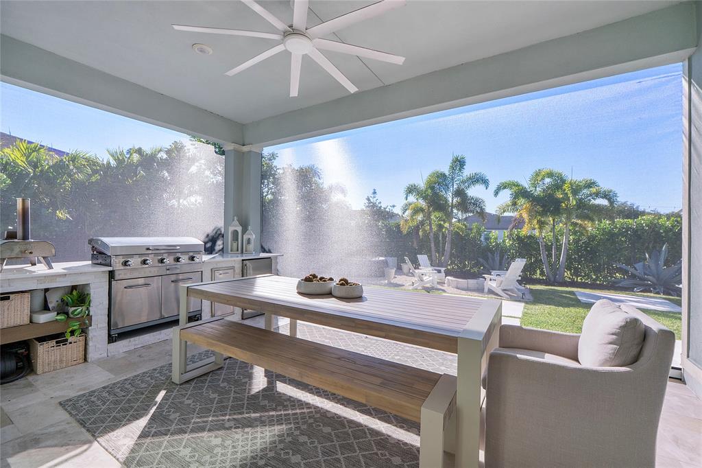 1131 Chisel Plow Chase Loxahatchee, FL 33470 - Photo 52 of 72 a view of a dining room with furniture a large window and a table