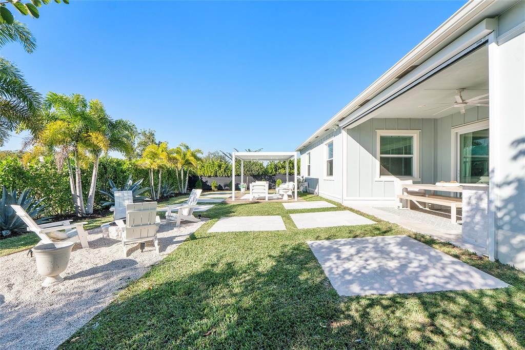 1131 Chisel Plow Chase Loxahatchee, FL 33470 - Photo 56 of 72 a view of a house with swimming pool and sitting area
