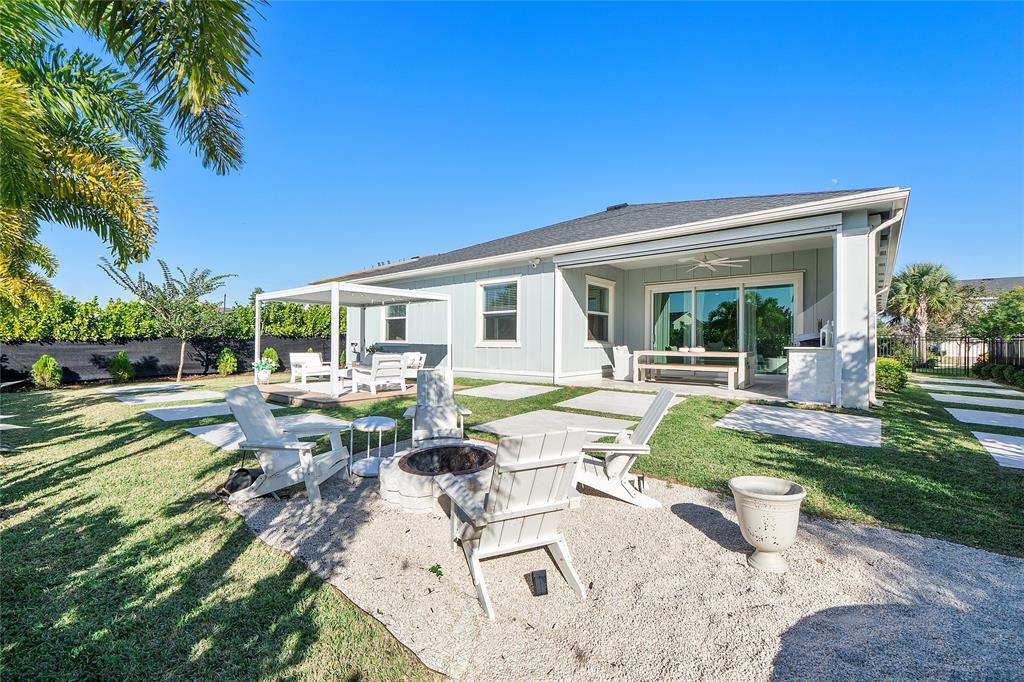 1131 Chisel Plow Chase Loxahatchee, FL 33470 - Photo 57 of 72 a view of a house with backyard porch and sitting area