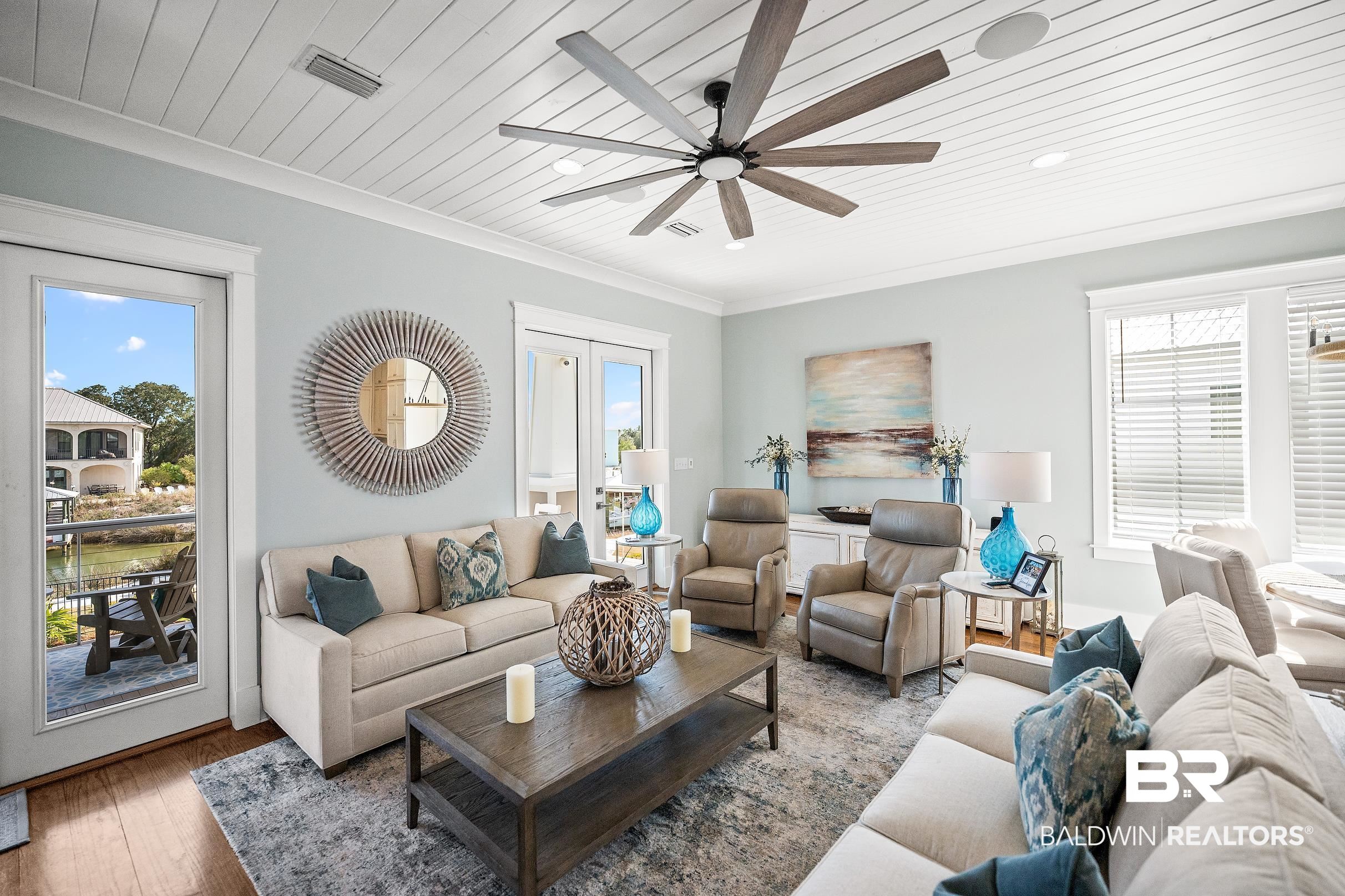 33186 Marlin Key Drive Orange Beach, AL 36561 - Photo 25 of 87 Living area with a ceiling fan, plenty of natural light, wood ceiling, wood finished floors, and ornamental molding