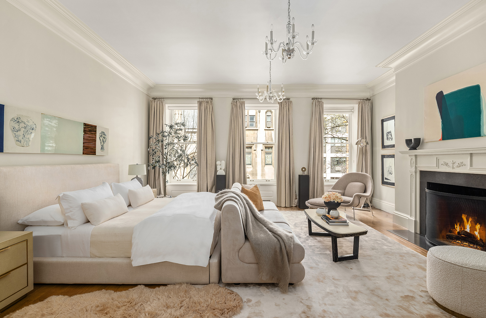 Undisclosed Address Manhattan, NY 10021 - Photo 11 of 25 a spacious bedroom with a bed and a fireplace