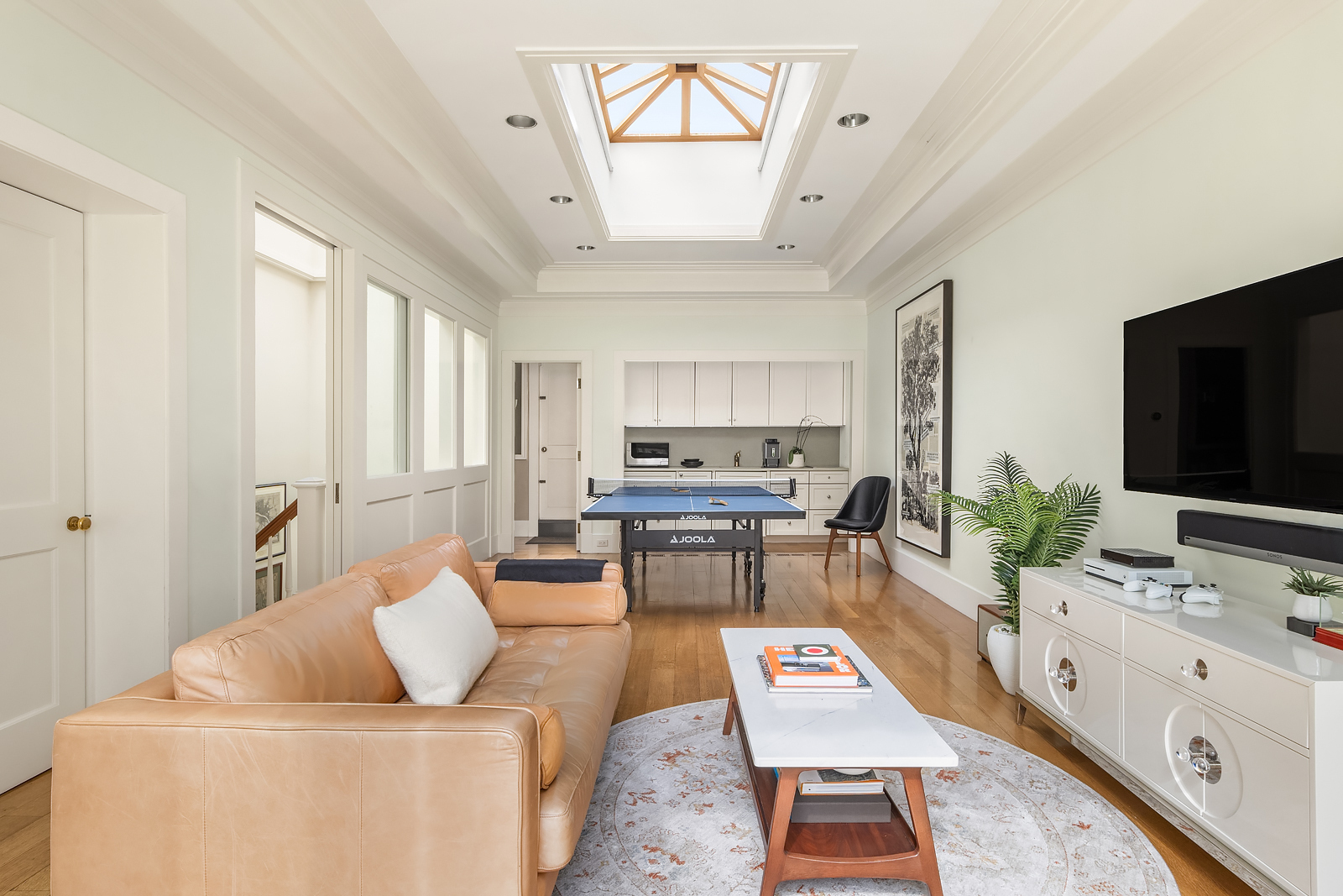 Undisclosed Address Manhattan, NY 10021 - Photo 20 of 25 a living room with furniture and a flat screen tv