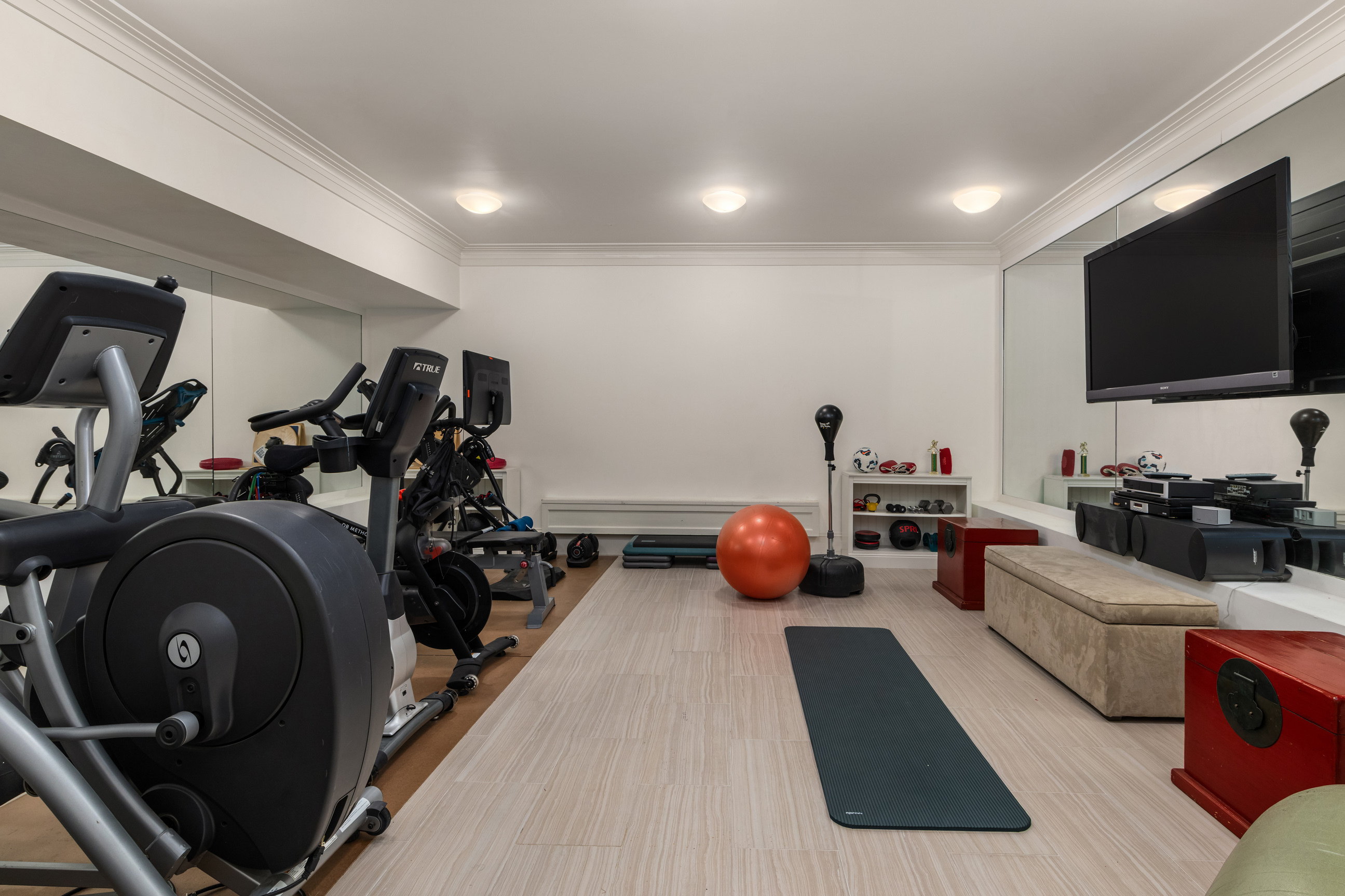 Undisclosed Address Manhattan, NY 10021 - Photo 23 of 25 a living room with furniture and a flat screen tv