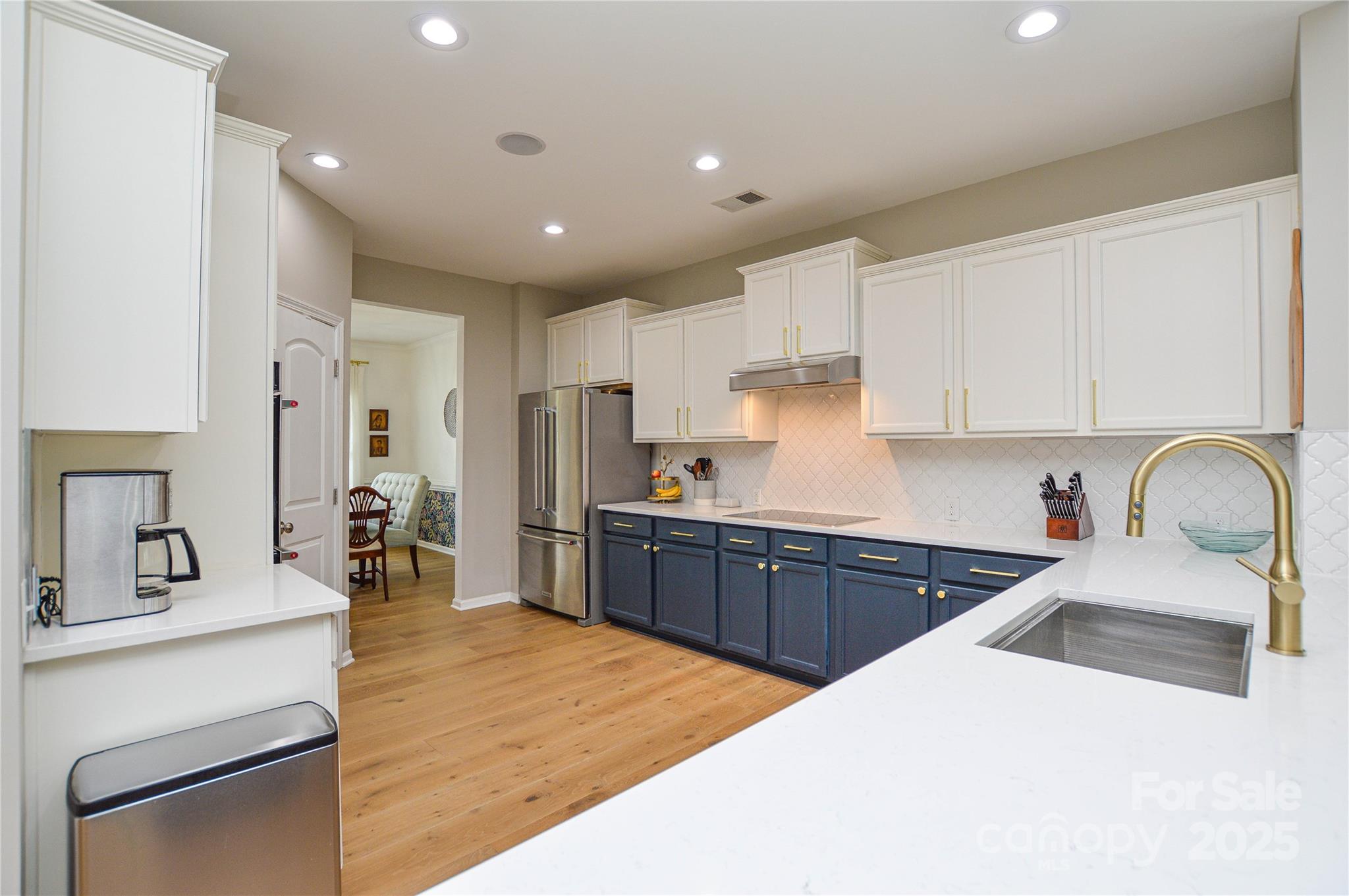 86506 Arrington Road Lancaster, SC 29720 - Photo 11 of 48 a kitchen with stainless steel appliances kitchen island a sink a stove and cabinets