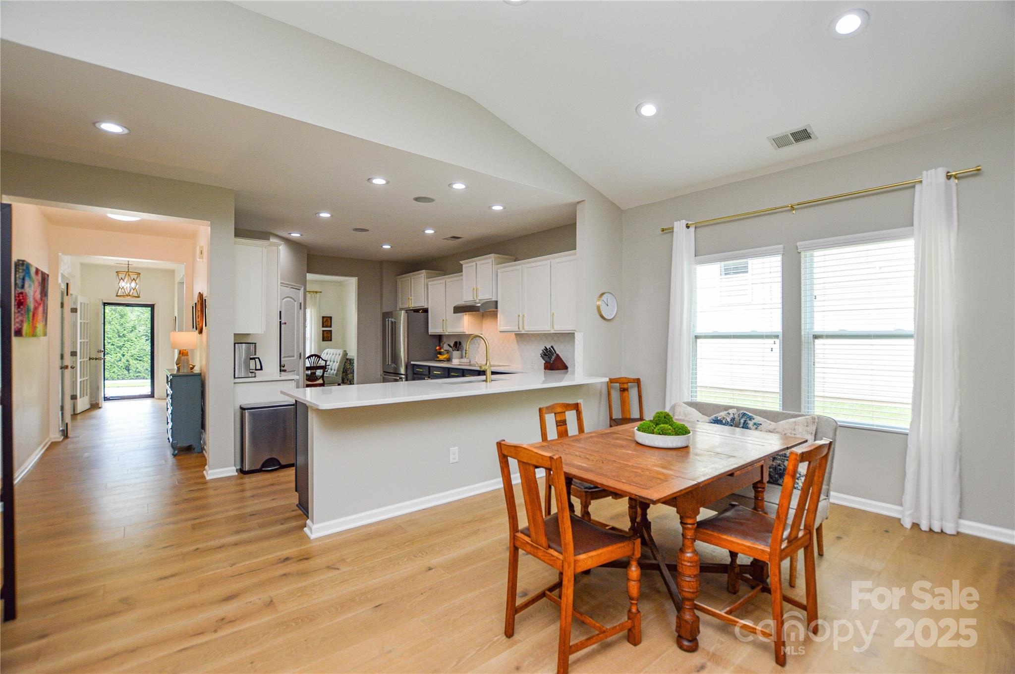 86506 Arrington Road Lancaster, SC 29720 - Photo 17 of 48 a view of a dining room with furniture and wooden floor
