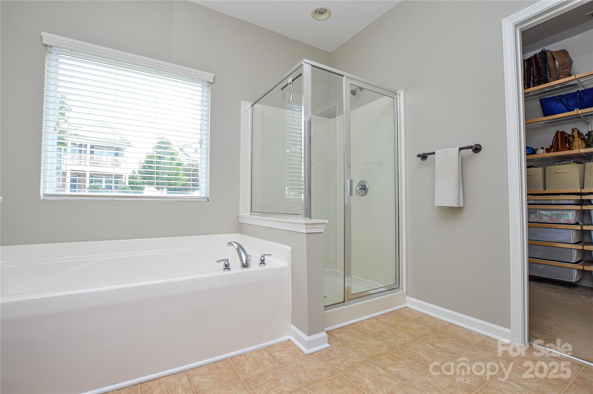 86506 Arrington Road Lancaster, SC 29720 - Photo 28 of 48 a spacious bathroom with a bathtub and a shower