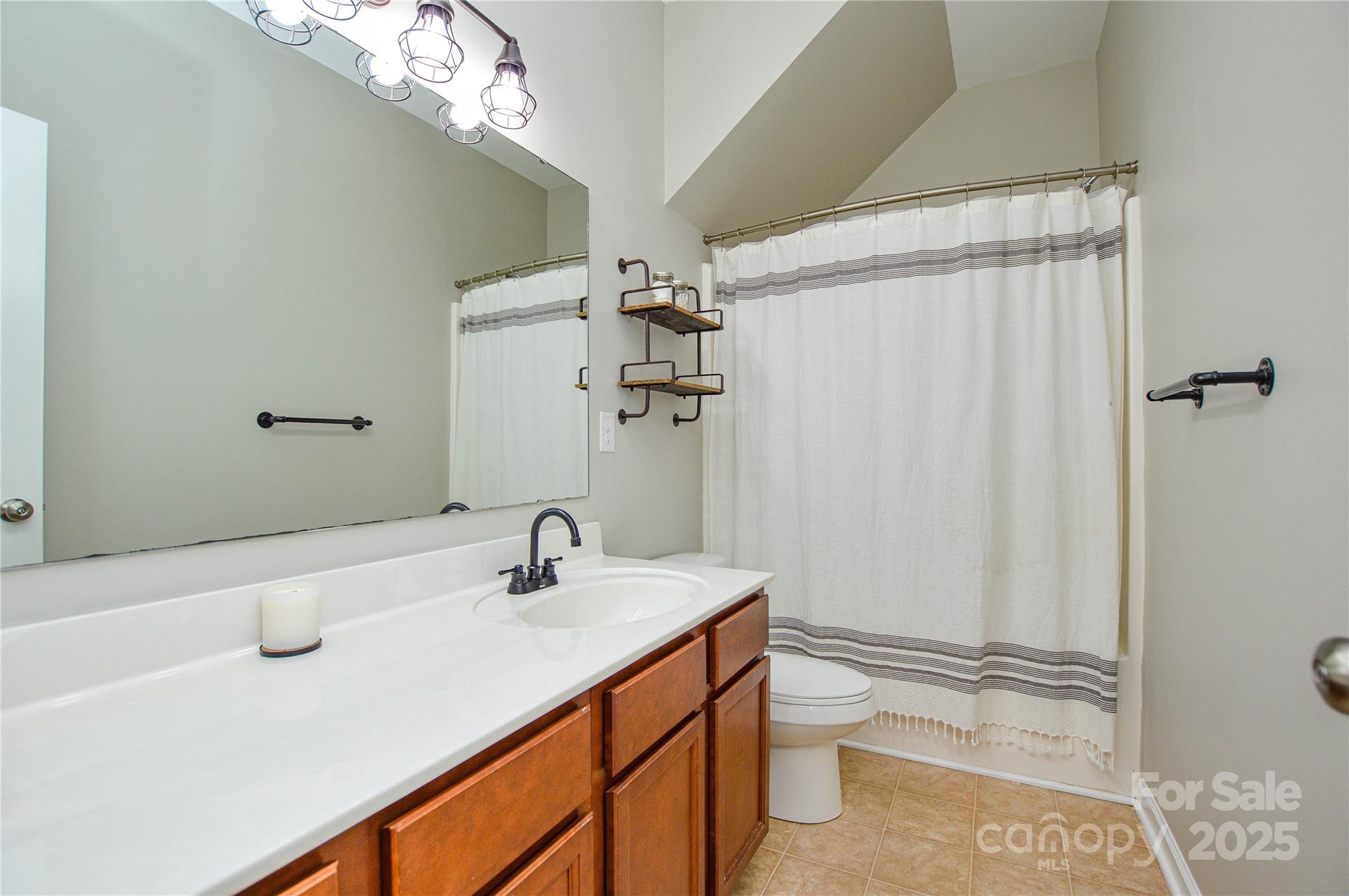86506 Arrington Road Lancaster, SC 29720 - Photo 36 of 48 a bathroom with a sink a toilet and shower