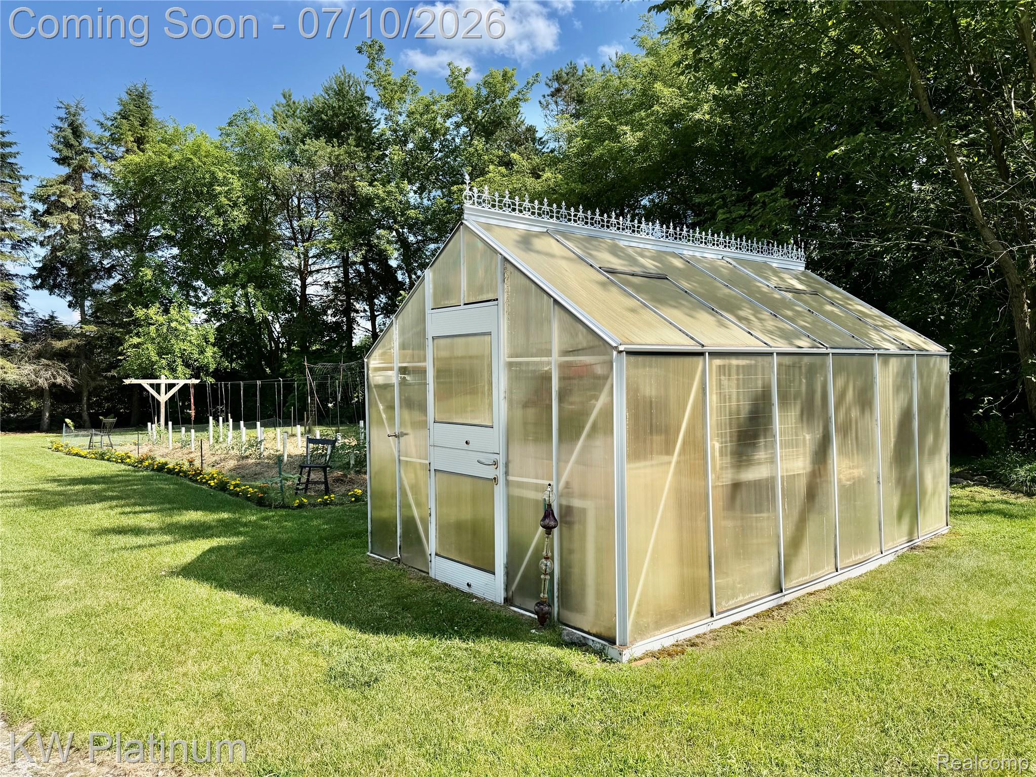1581 Emerson Road Goodells, MI 48027 - Photo 28 of 45 Freestanding greenhouse with ornate roof detailing and translucent panels